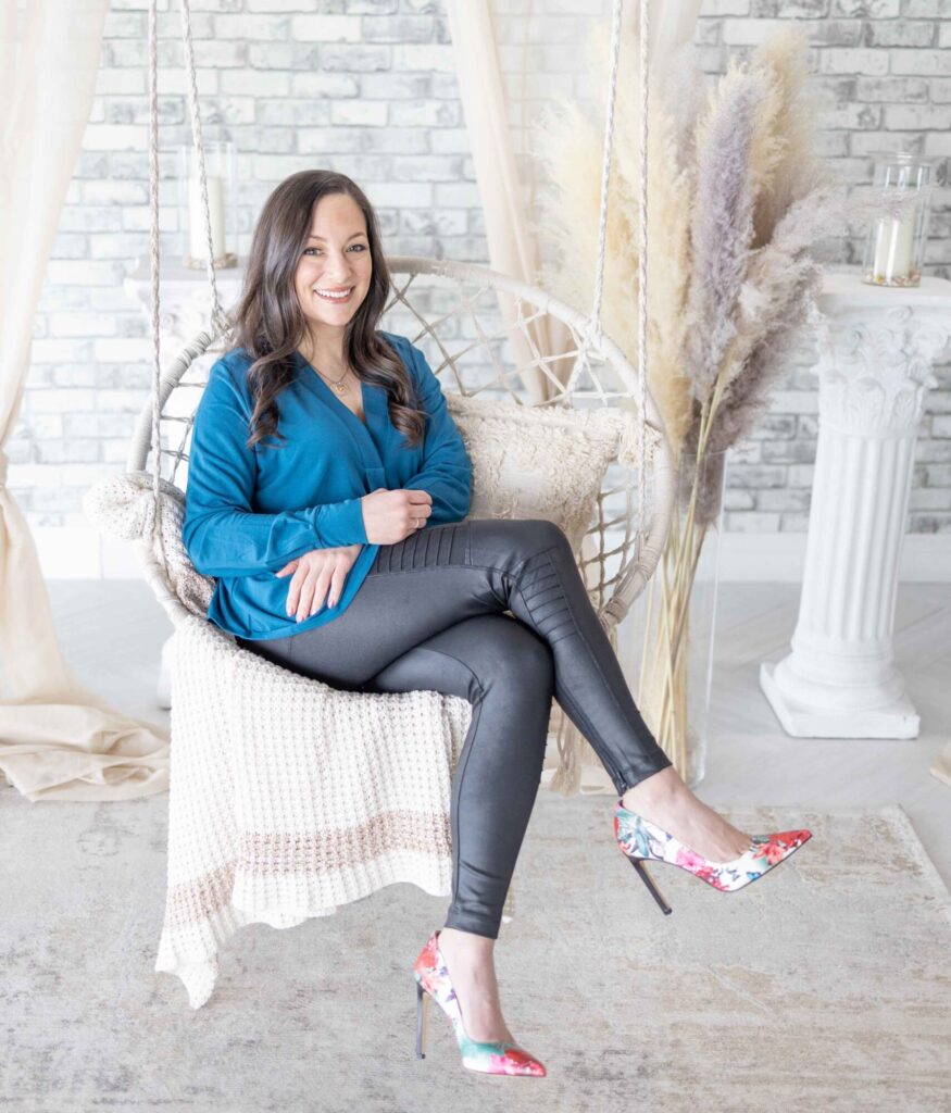 woman sitting on a swing indoors