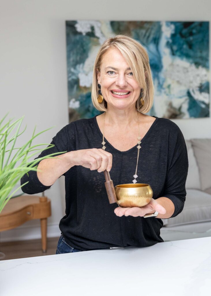woman holding a sound bowl