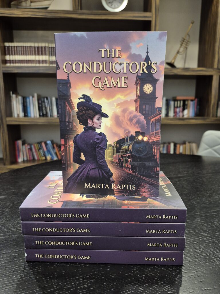 Stack of “The Conductor’s Game” books by Marta Raptis on a dark table, showing the cover illustration of a woman in Victorian attire standing near a steam train.
