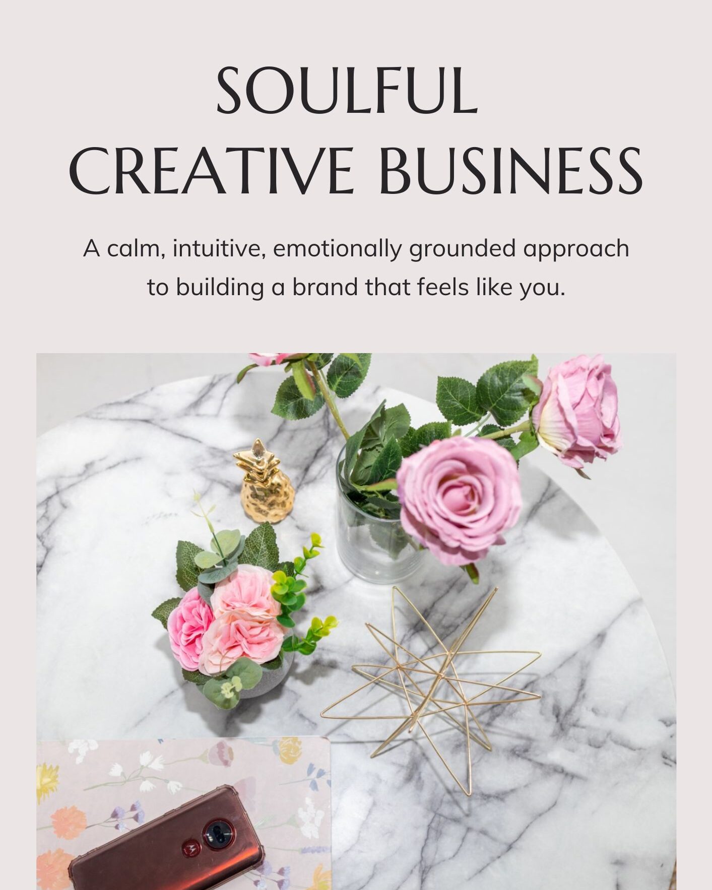 Flat‑lay cover image of the Soulful Creative Business guidebook featuring pink roses, greenery, and a marble background — designed by Marta Raptis to represent a calm, intuitive approach to creative business.
