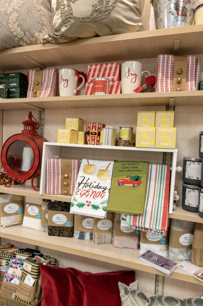 Product photography of shelves with books, mugs, and décor items for a small business in Oakville