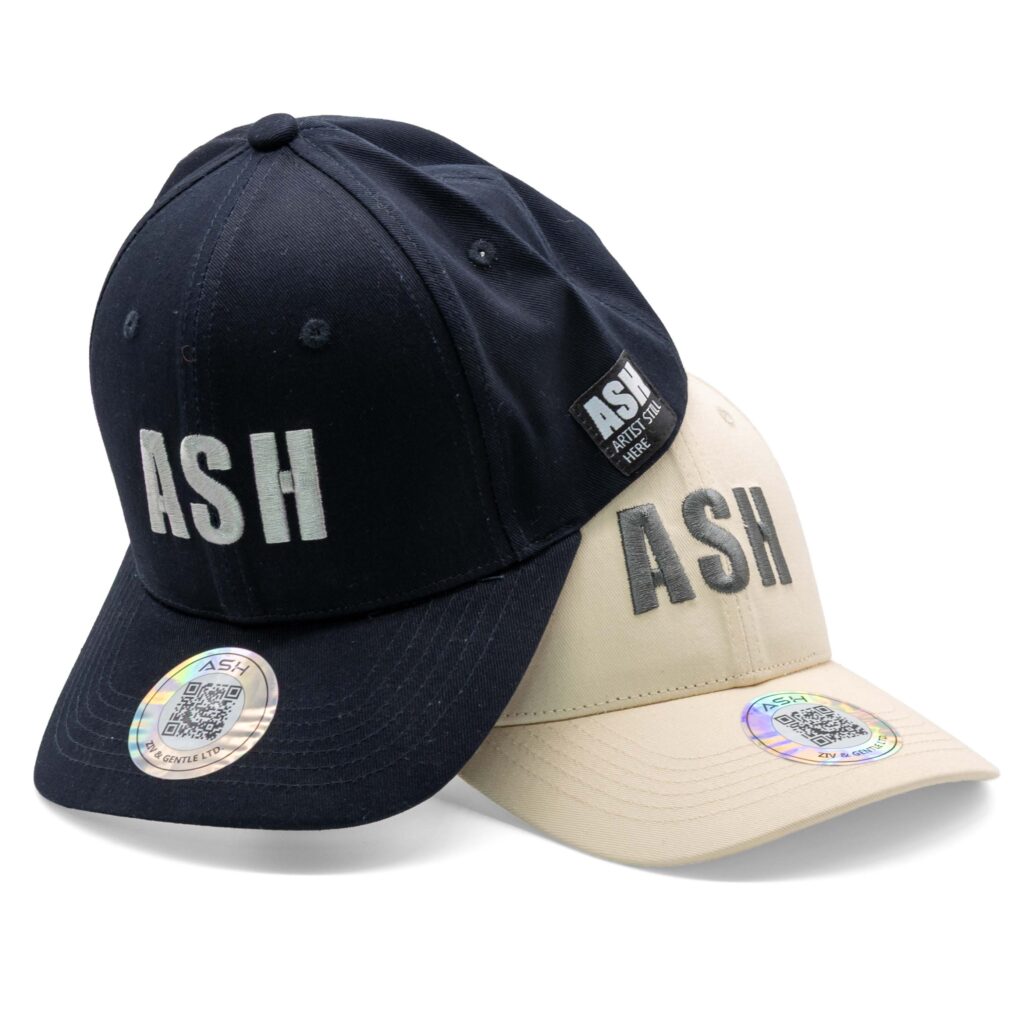 Pair of ASH caps in beige and black, displayed together for product photography showcasing texture and design.